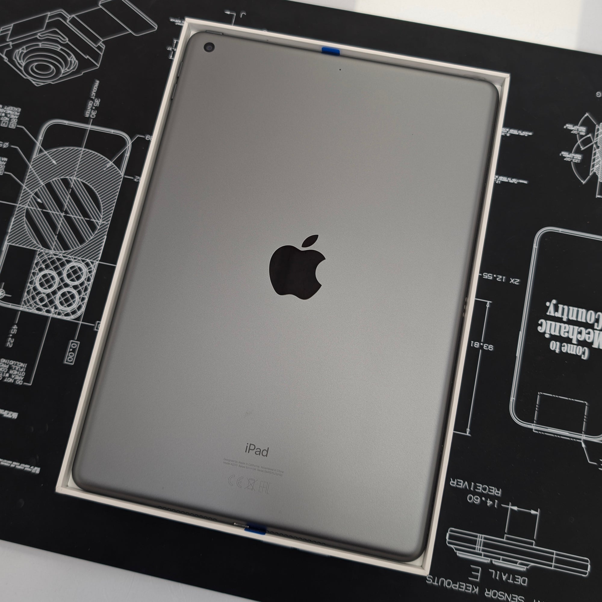 Apple iPad on a technical drawing background