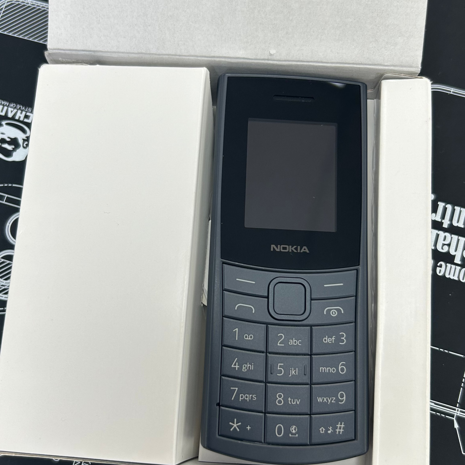 Nokia phone in a box on a technical drawing background
