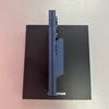 Folding phone with &#39;Z Fold6&#39; branding on a black stand against a light gray background